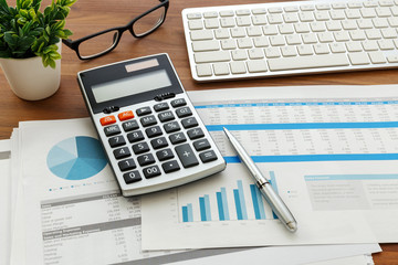 Chartered Accountant in Coimbatore have calculator and growth analyzing chart